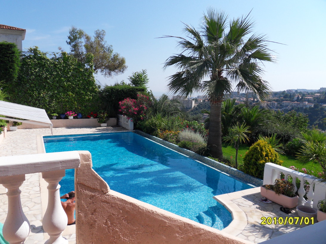 On terrace overlooking sea